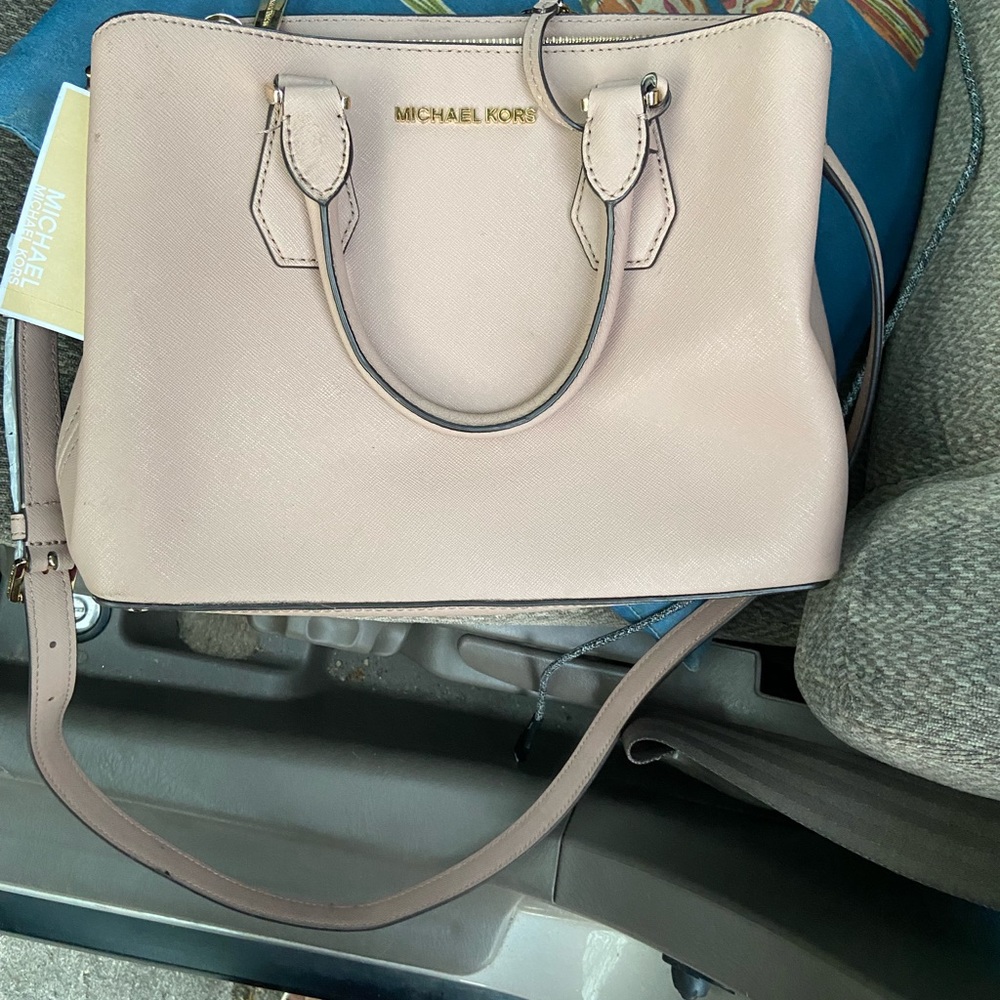 Got Michael Kors bag for sale it’s too small for me bag is new still has tag on
